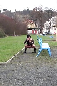 Filthy Black-haired Slut Pissing In A Public Park