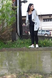 Black Haired Gal Sprinkles Her Pee Off A Ledge